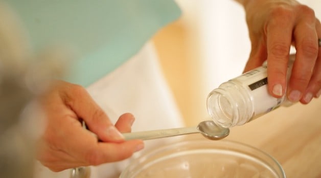 Measuring cream of tarter in a measuring spoon