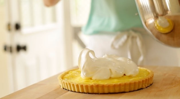 Adding whipped Meringue on top of a baked tart shell filled with lemon curd