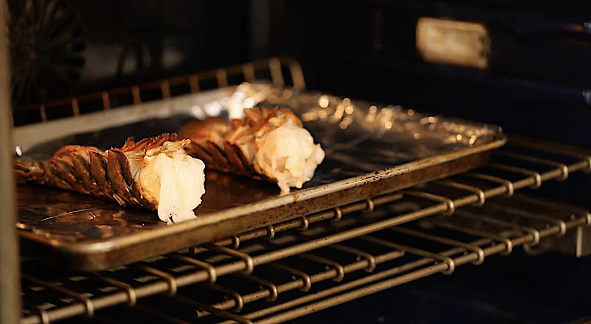 Lobster Tails baking in the oven on a sheet pan 