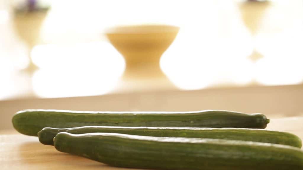 English Cucumbers resting on cutting board 