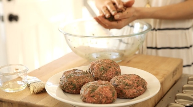 forming burger patties and placing them on a plate