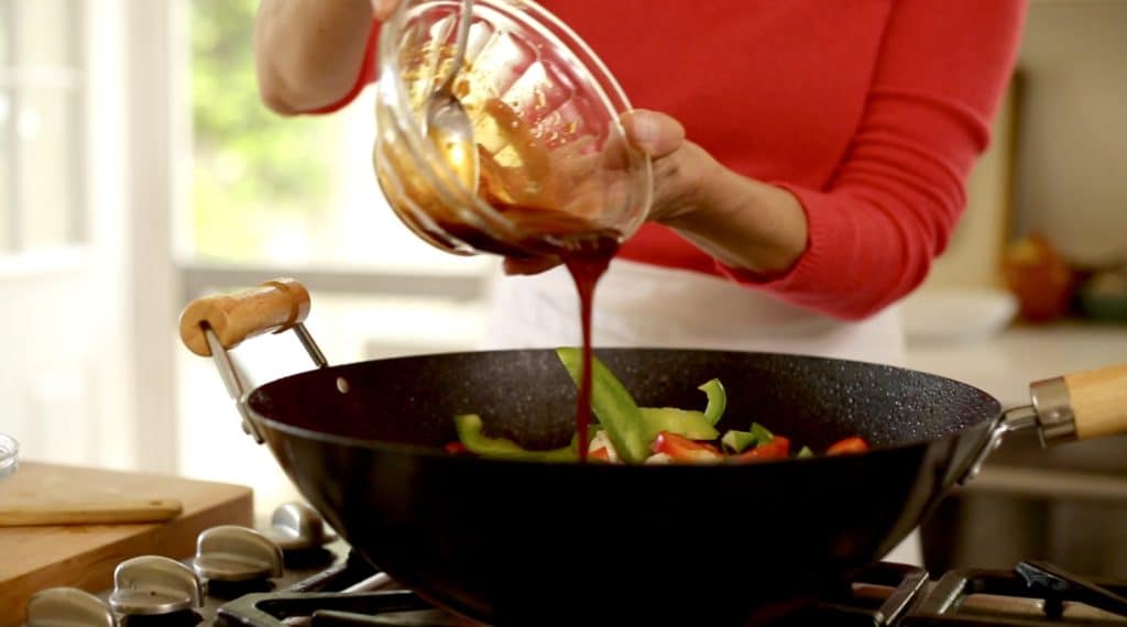 Sauce being added to anEasy Cashew Chicken Recipe