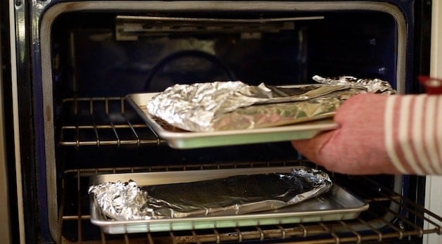 Placing rib packets in oven on 2 different racks