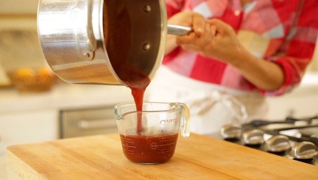 Pouring Homemade BBQ Sauce to a Pyrex Pitcher