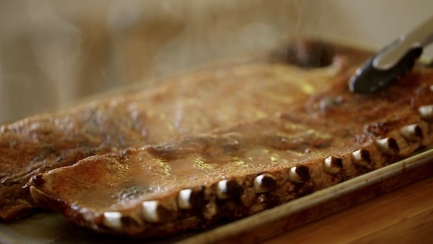 Oven Baked Ribs resting on a sheet pan