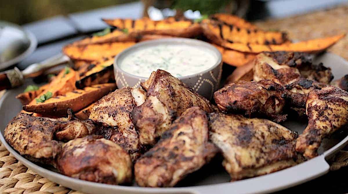 a platter of grilled cinnamon chicken and sweet potatoes