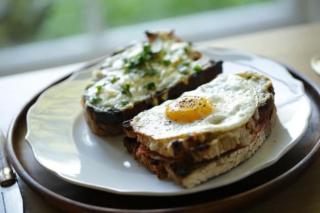  Croque Madame and Croque Monsieur sandwiches on a plate