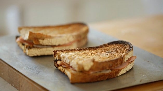 Croque Monsieur and Croque Madame Sandwiches on a baking sheet