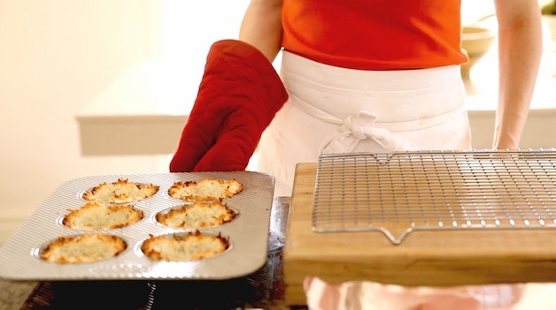 Freshly Baked Ice Cream Bowls in a Jumbo Muffin TIn with a red Oven Mitt holding them