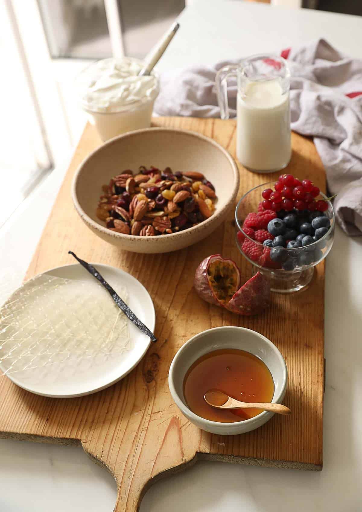 Ingredients on a board for making a breakfast panna cotta with yogurt.