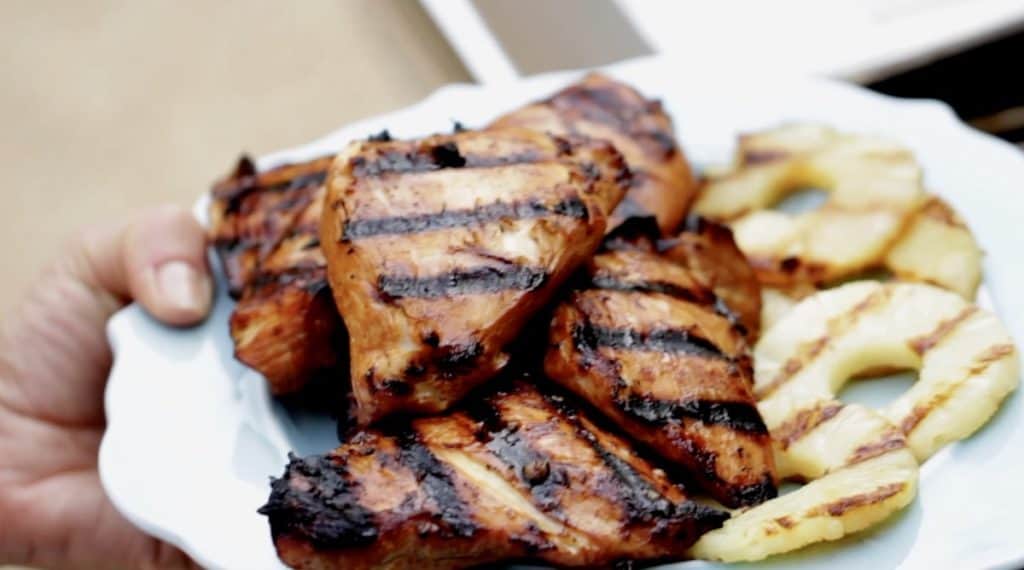 A plate of Grilled Teriyaki Chicken Breasts and Grilled Pineapple