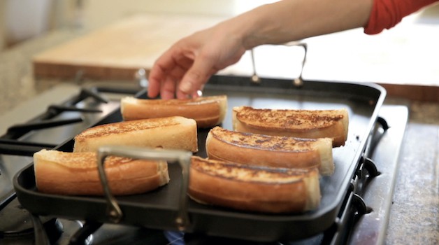 grilling split top buns on a cooktop griddle