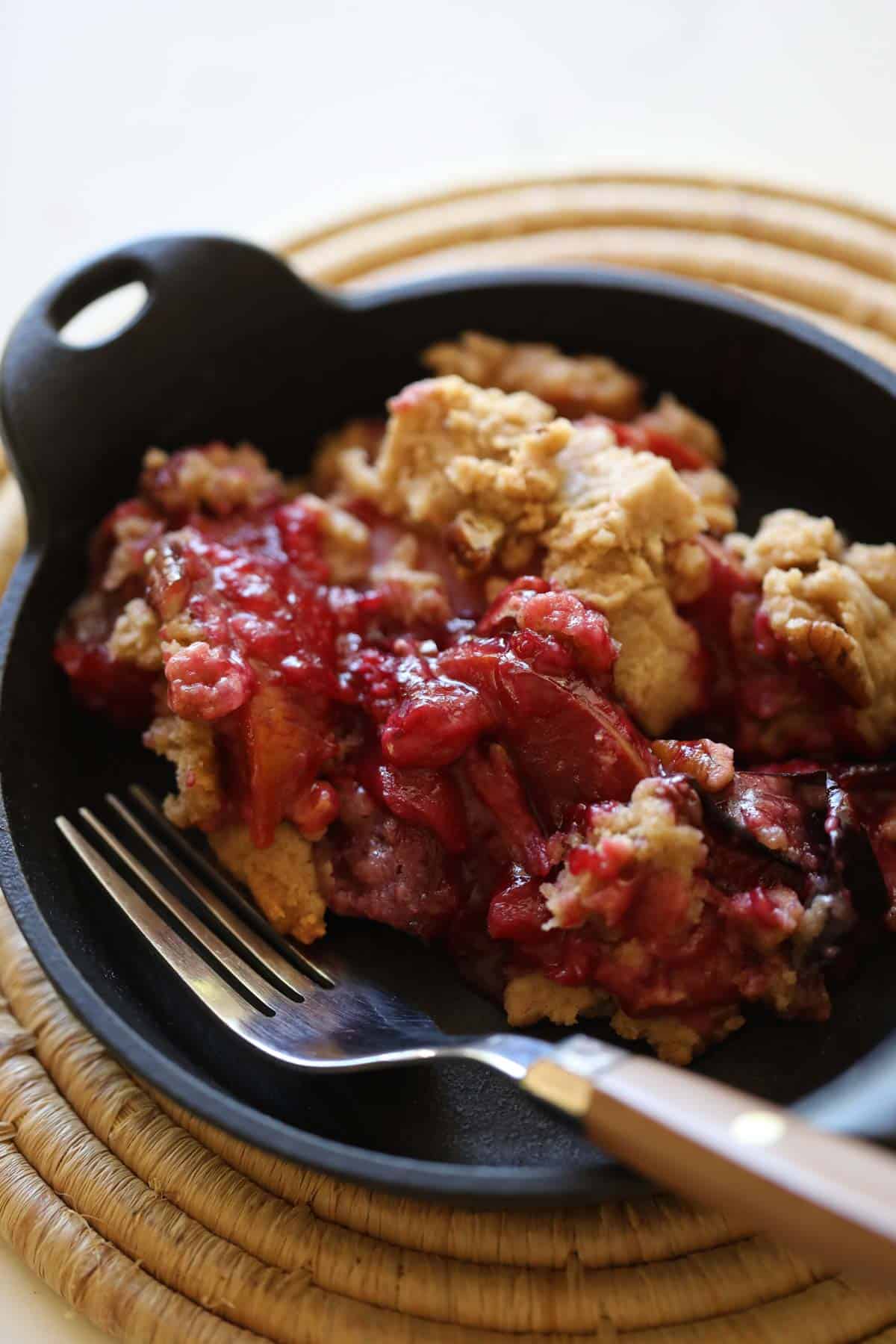 Plum Crumble in a Black Bowl