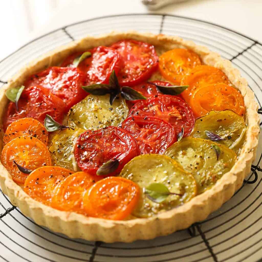 A French Tomato Tart on a cooling rack.