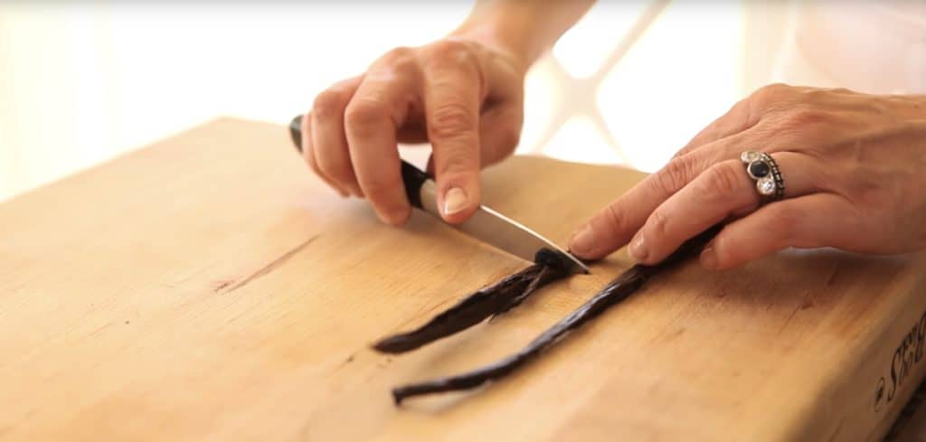 Vanilla Bean pod being scraped of its seeds