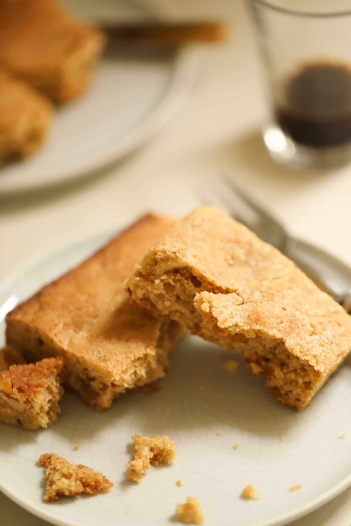 a brownie on a plate pulled apart to show the butterscotch chips inside