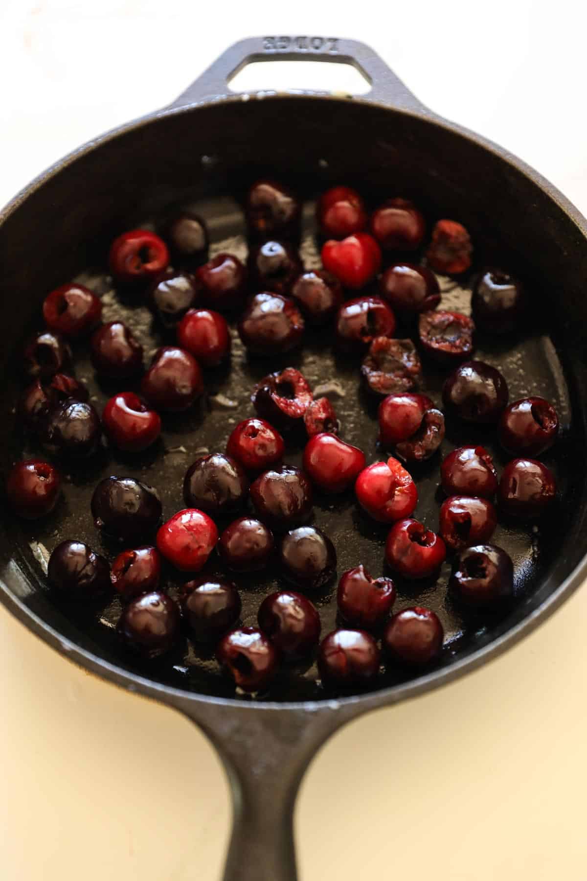 pitted cherries in a cast-iron skillet