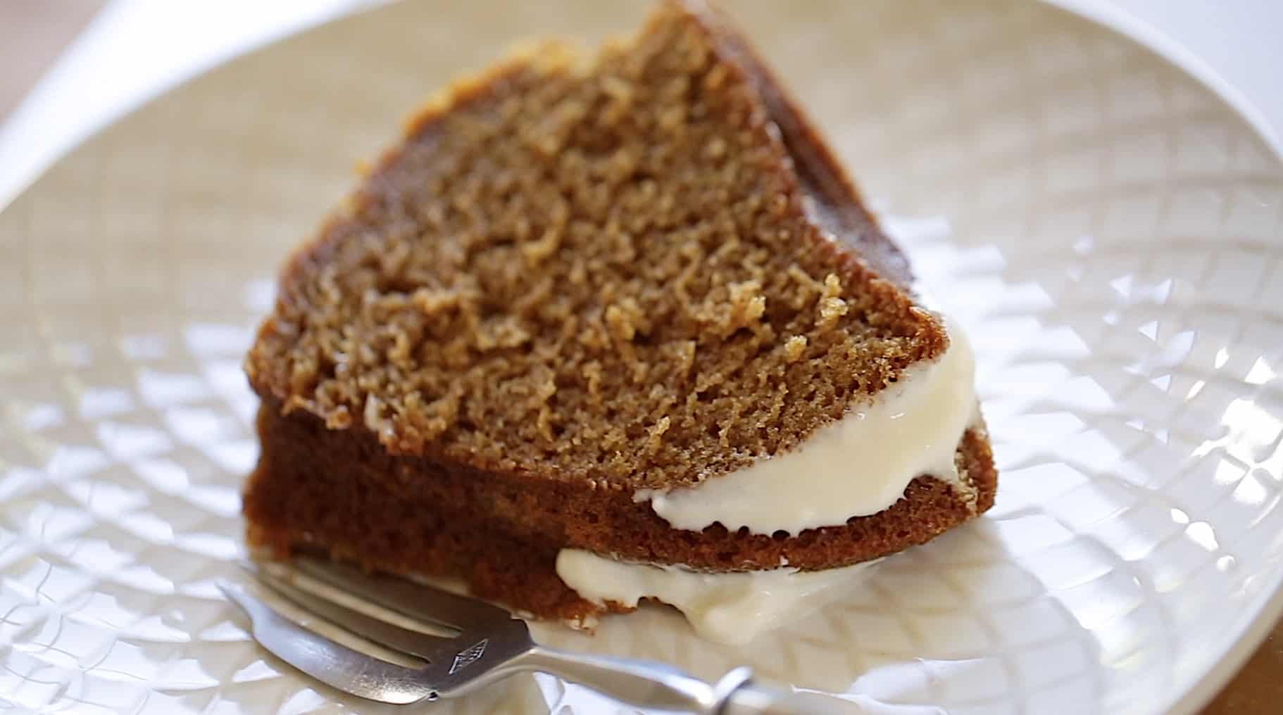 a slice of Apple Spice Cake with cream cheese frosting