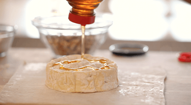 Honey drizzled over brie wheel