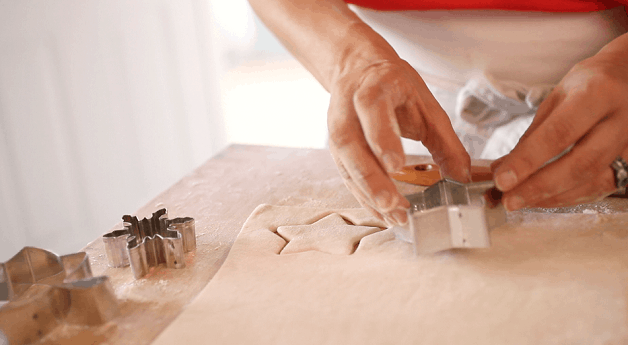 Cutting star-shaped pastry with cookie cutter