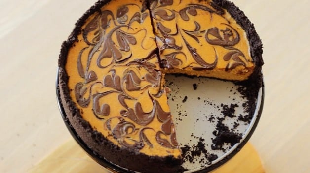 Overhead shot of Chocolate Pumpkin Cheesecake with missing slice