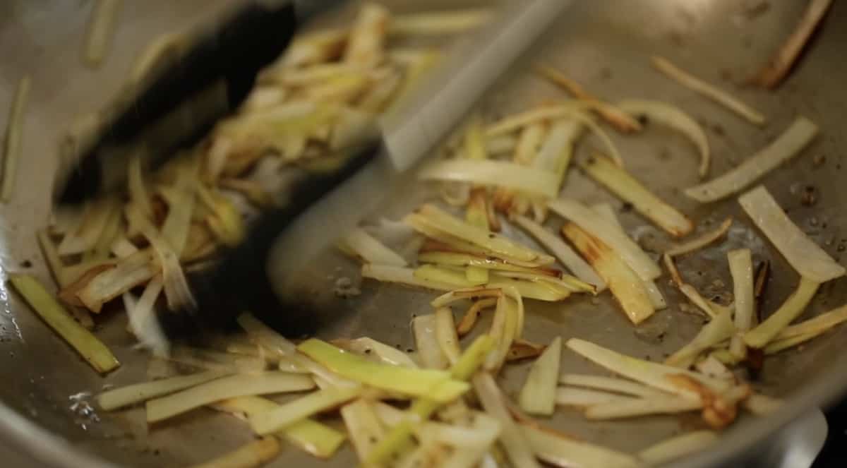 sautéing leeks in a skillet