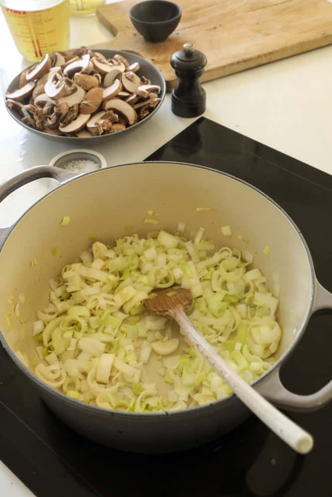 Leeks, Onions and garlic in a soup pot cooking.