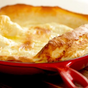 Dutch Baby Pancake fresh from the oven in a Red Skillet