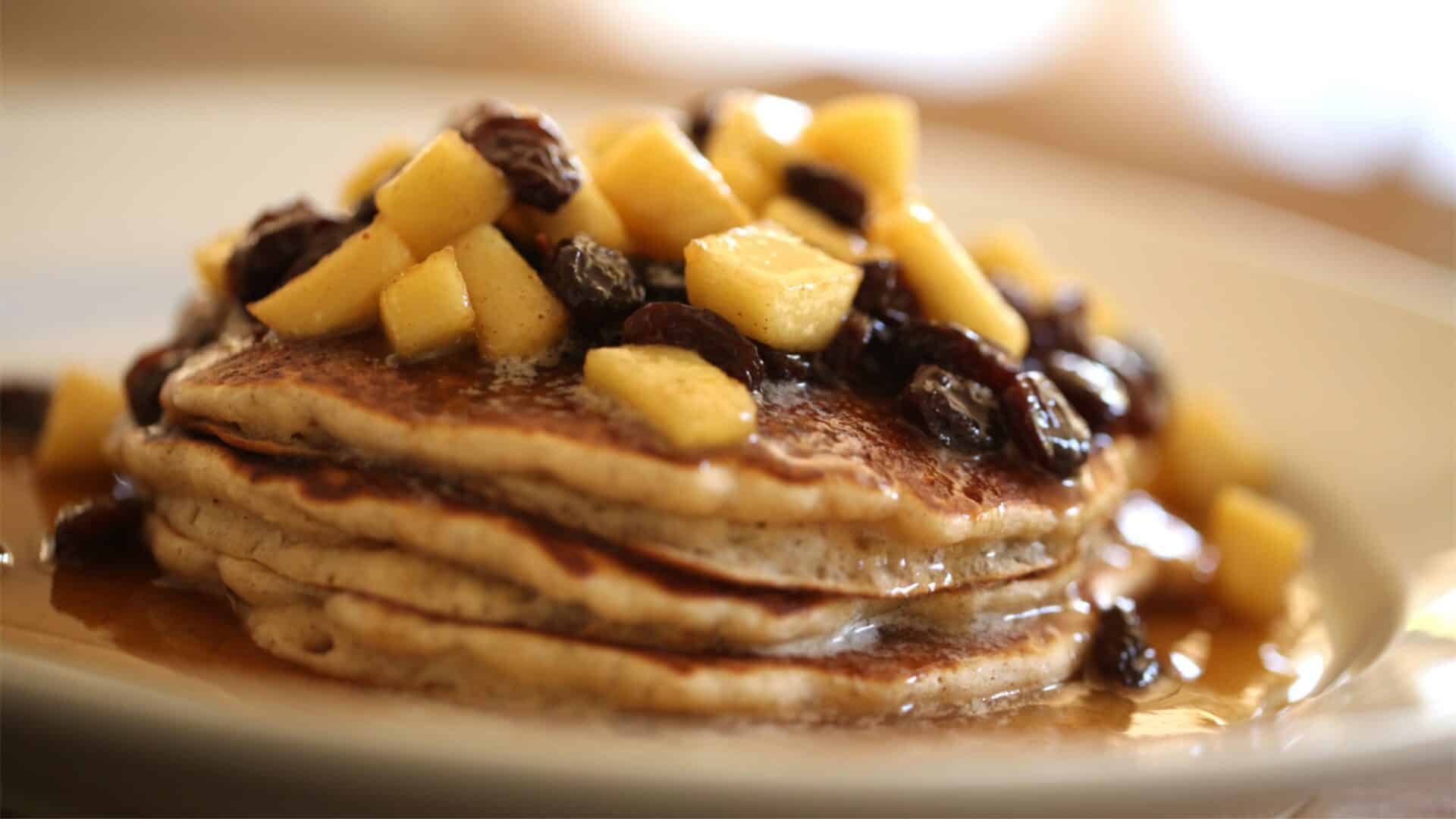 Apple Cider Pancakes with Apples and Raisins on top