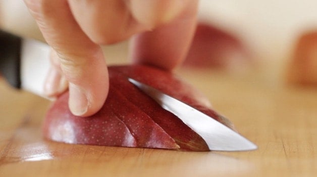 slicing pears on a cutting board