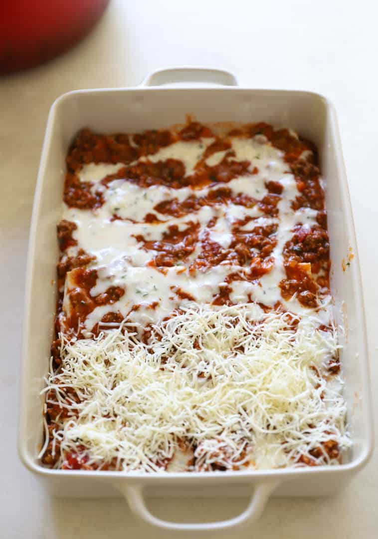 Bechamel and grated Italian cheese added to the meat sauce layer