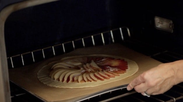 Placing Pear Tart in the oven 