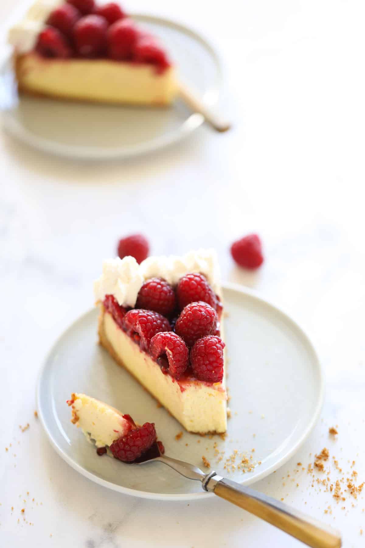 a slice of cheesecake with a bite taken out of it