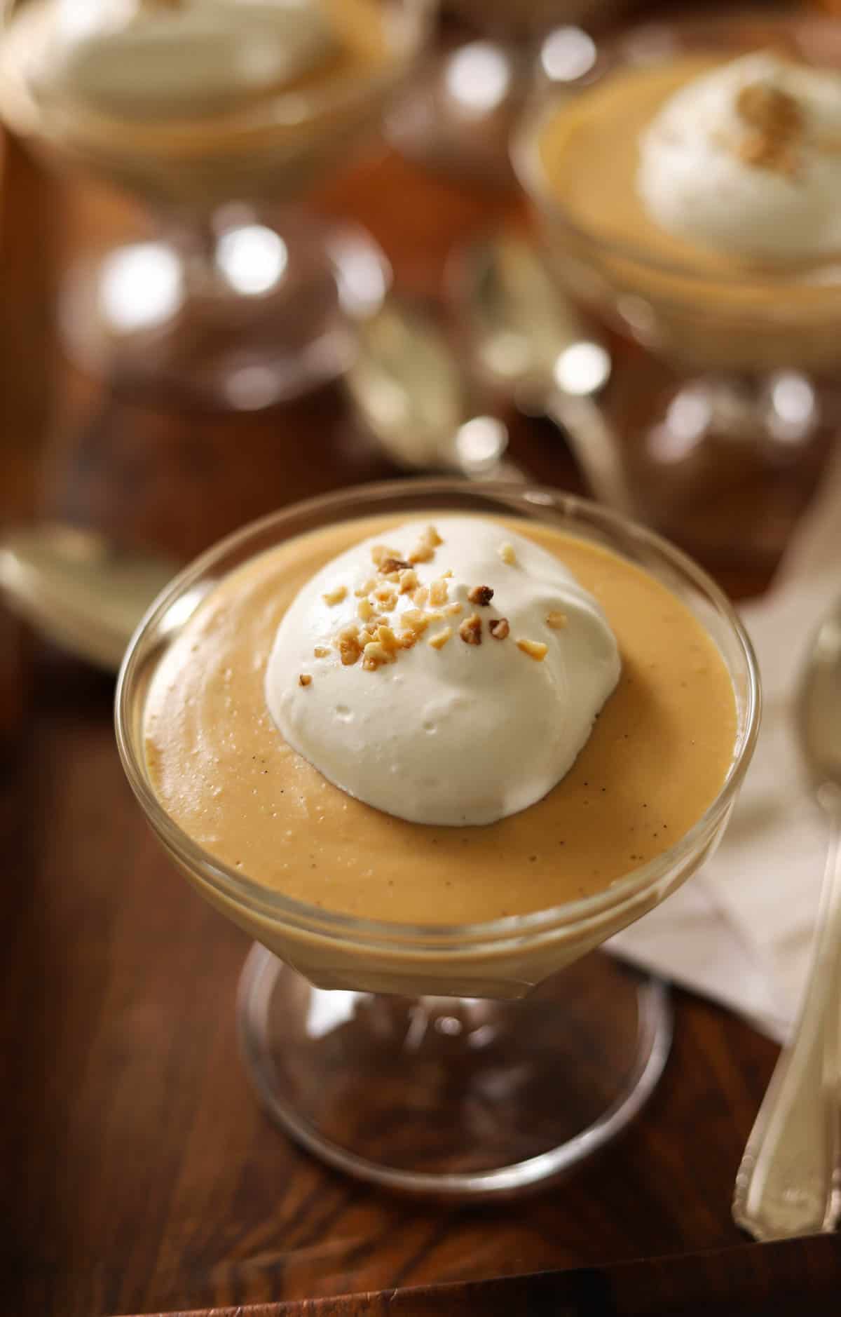A salted caramel pudding in a glass dish.