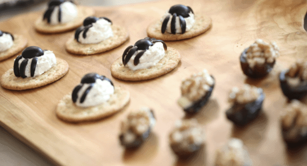 Crackers with Cheese topped with olives to look like spiders