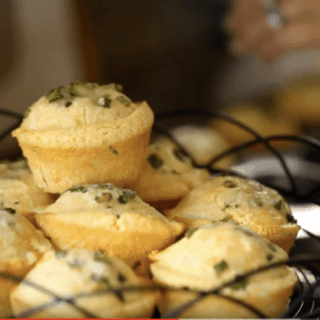 Cornbread Muffins piled on a wire cake stand