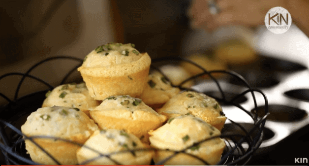 Cornbread Muffins piled on a wire cake stand