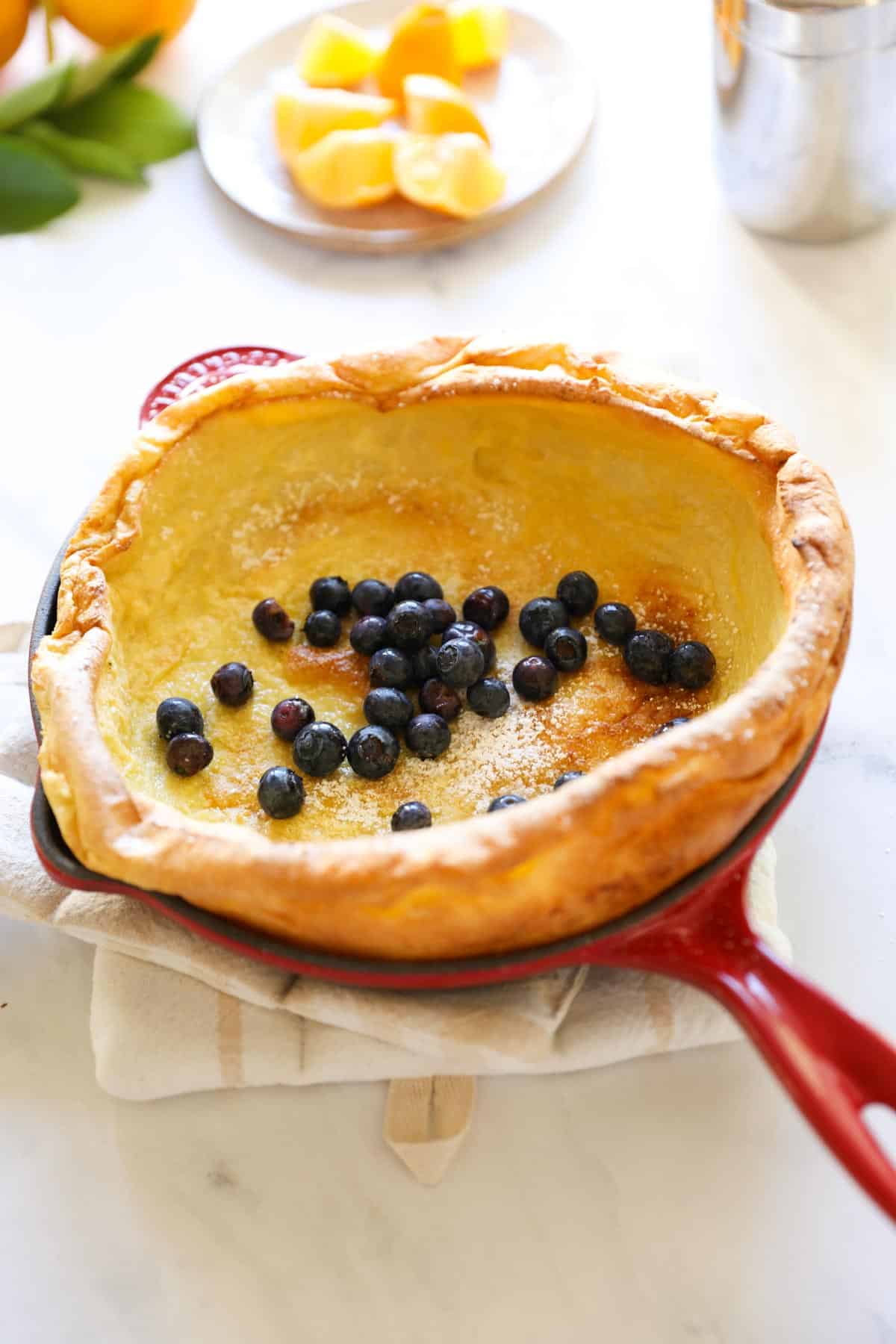 Skillet pancake topped with blueberries