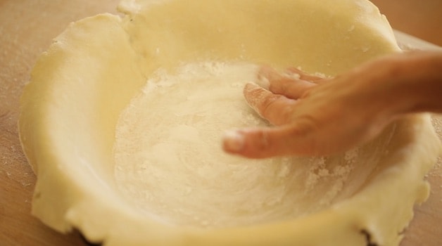 adding cornstarch to the bottom of a pie shell