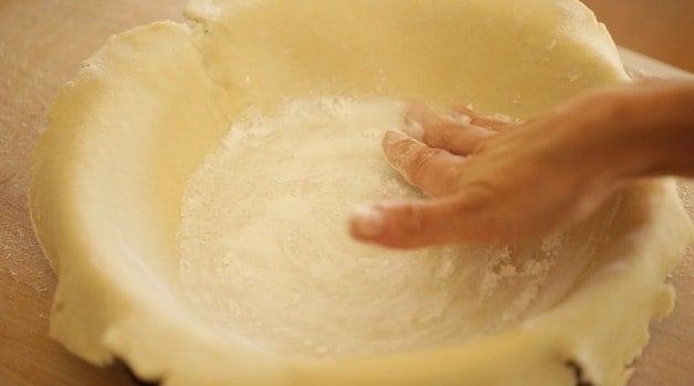 adding cornstarch to the bottom of a pie shell