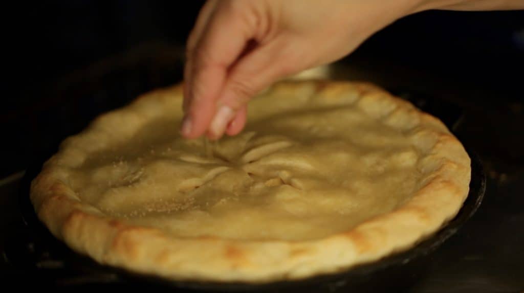 Sprinkling Turbinado Sugar on pie when it's in the oven