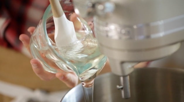 Pouring corn syrup into stand mixer