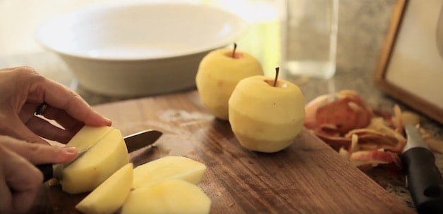 Slicing apples on a walnut cutting board