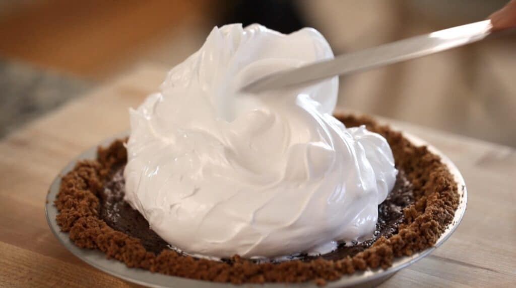 Adding marshmallow topping to a s'more pie