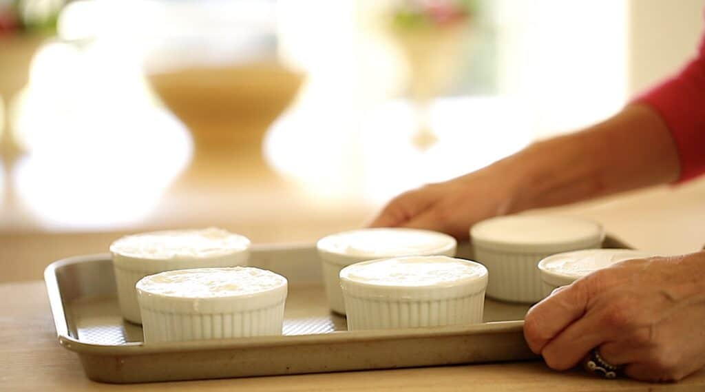 tray of meringue in ramekins ready for the oven