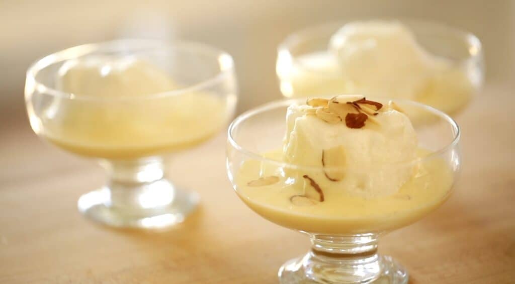 Floating Islands on bowls with almonds on top