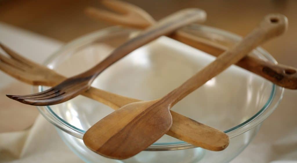Lining wooden utensils on a bowl for making spun sugar