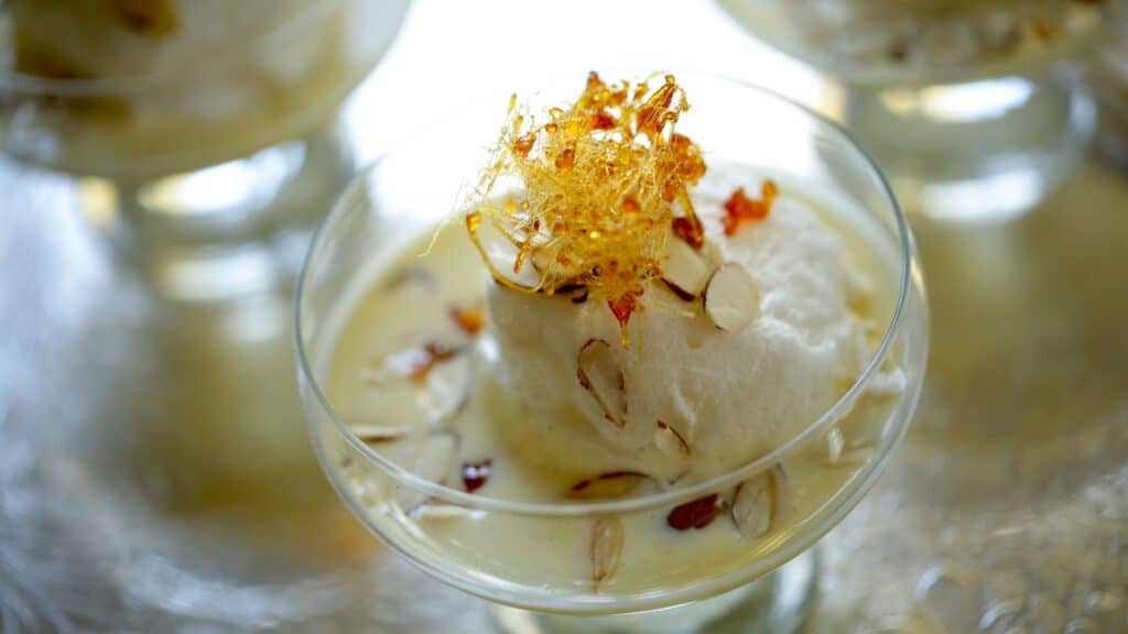 a detail of a spun sugar garnish on top of a ile flottante