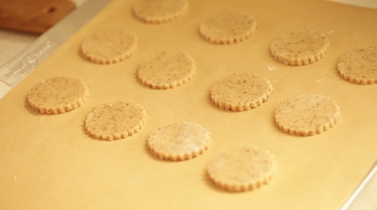 Cookie Bottoms cut out and placed on a sheet tray