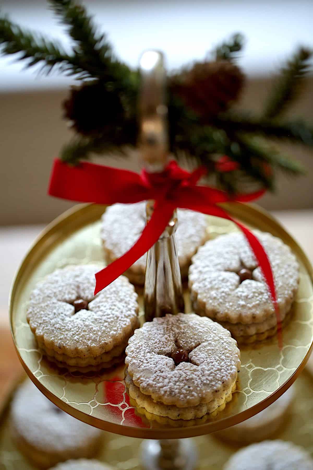 Hazelnut Chocolate Linzer Cookies on a gold platter